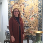 Susan enjoying Asian art preview at auction house