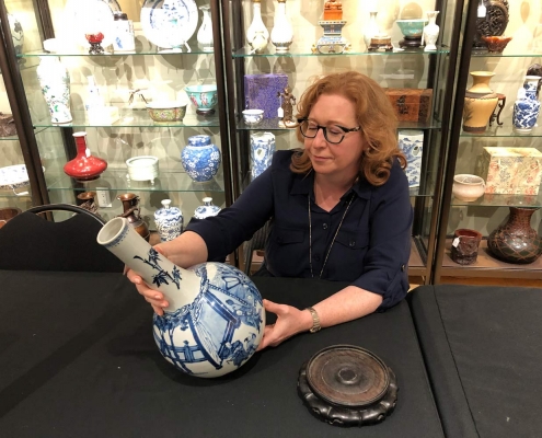 Image of Susan Lahey appraising a vase