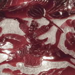 Close up of a warrior vase (Red and White painted Chinese glass)